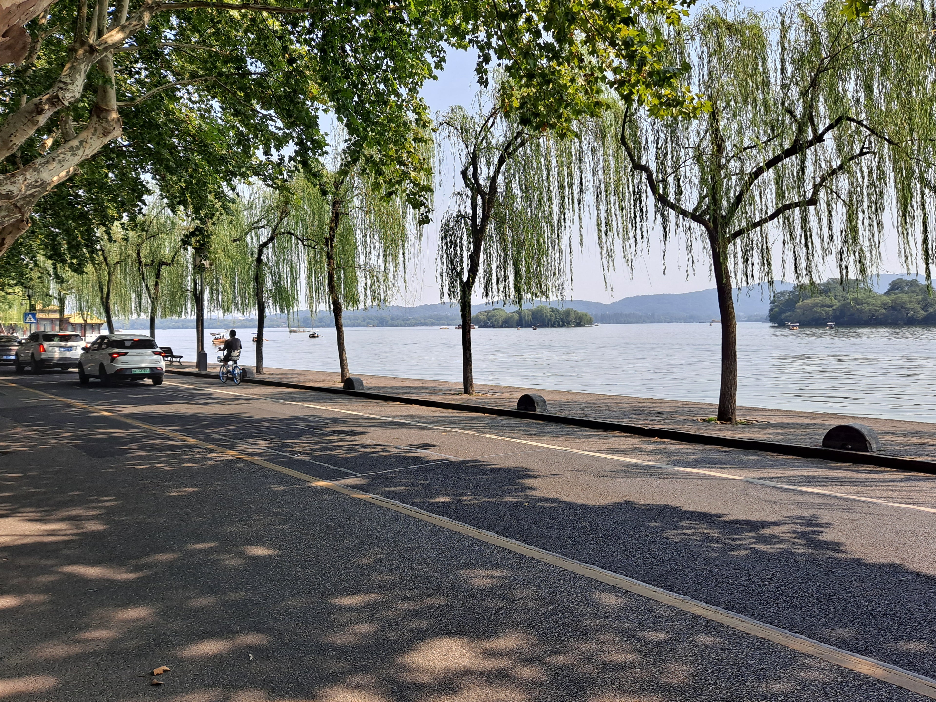 Bai Causeway crossing West Lake in Hangzhou as part of the lived public landscape