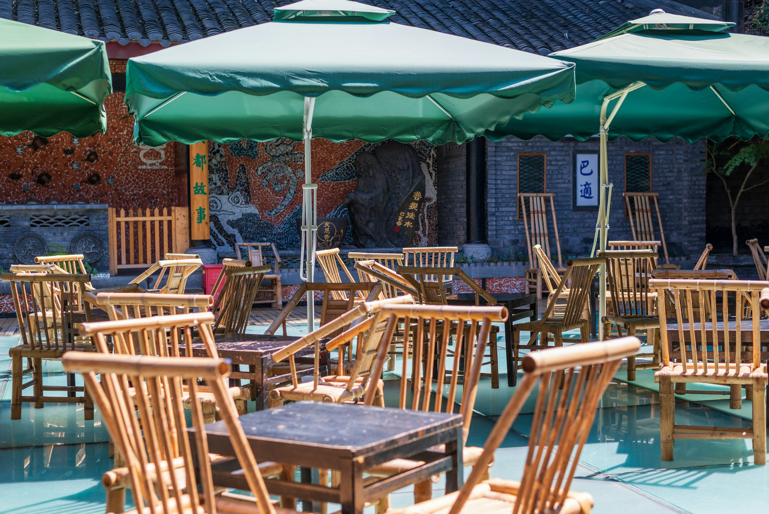 Bamboo chairs and shaded tables at a teahouse by Daci Temple in Chengdu.