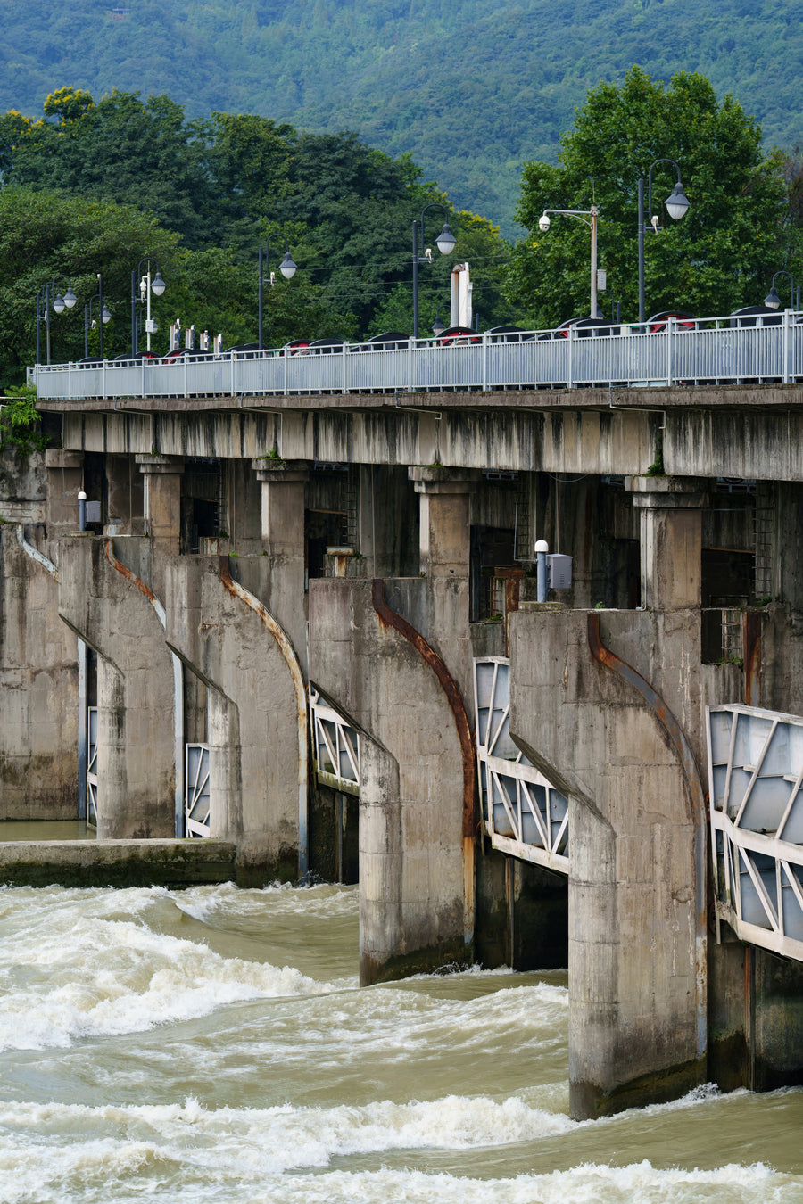 River water rushing through concrete control gates at Dujiangyan in Chengdu.