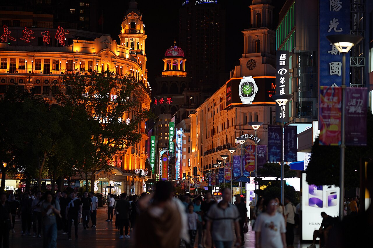 Crowds on Shanghai's Nanjing Road at night beside the Shanghai First Foodhall