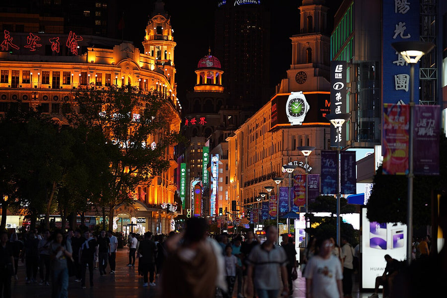 Crowds on Shanghai's Nanjing Road at night beside the Shanghai First Foodhall
