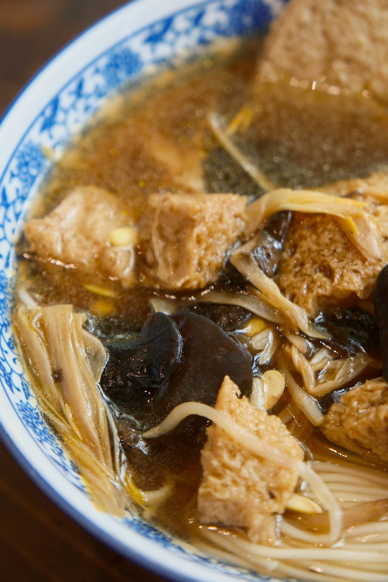 A blue-and-white bowl of noodles and tofu in Suzhou.
