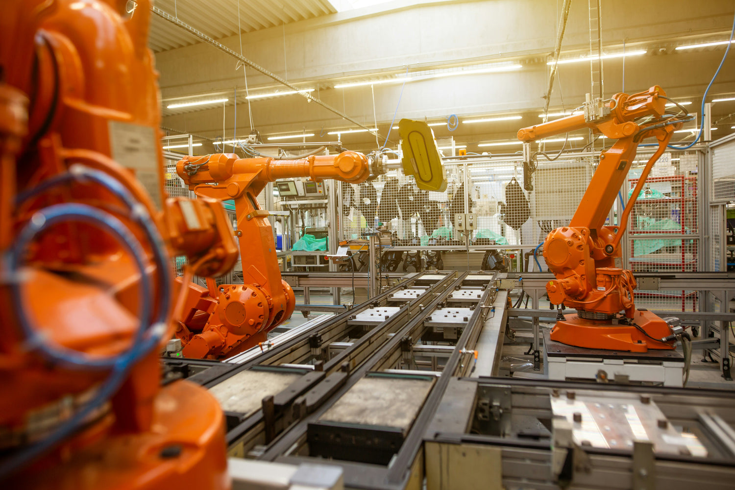 Industrial robots operating along an automated automotive production line.