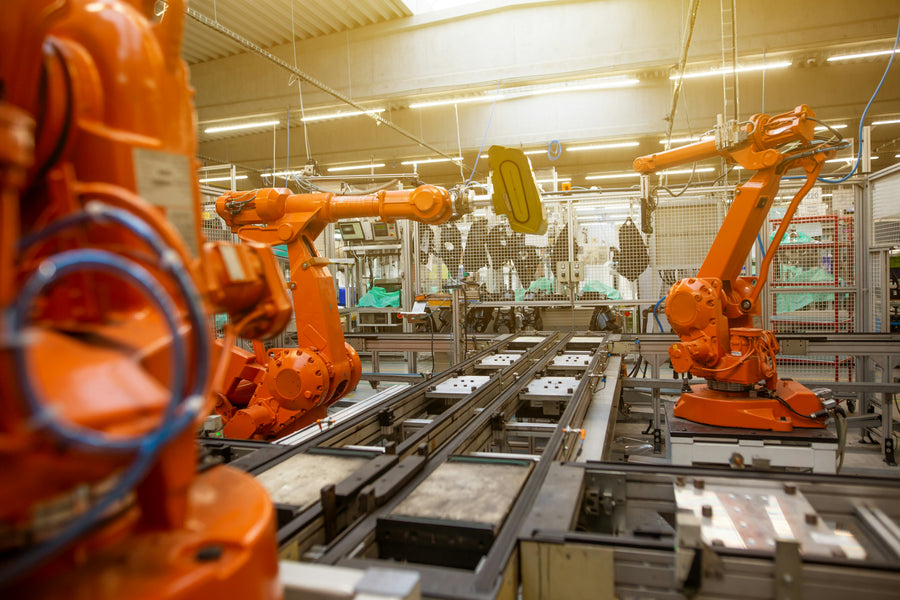 Industrial robots operating along an automated automotive production line.