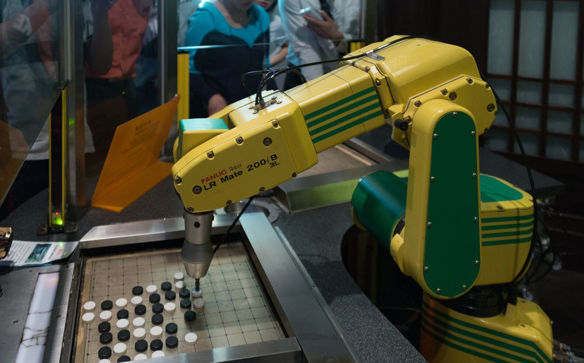 A visitor engaging with a robot at the Shanghai Science and Technology Museum